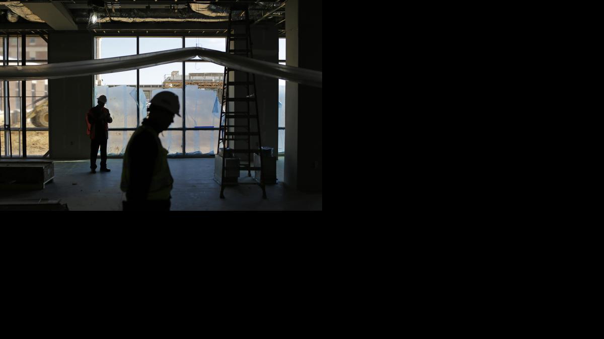 
In this March 12, 2015 photo, officials walk inside a Veterans Affairs outpatient clinic that is under construction in Fayetteville, N.C. The hospital's director since 2010, Elizabeth Goolsby, cites the VA's failure to expand quickly as a primary reason for why eastern North Carolina now has some of the longest waits for care in the country. 
