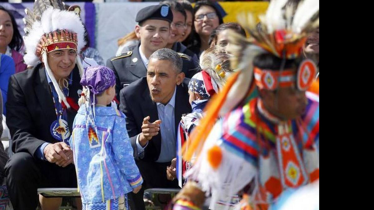 
President Barack Obama wants more Indian tribes to run federally controlled schools. Here he’s shown with two young boys during a Native American dance on the Standing Rock Indian Reservation in Cannon Ball, N.D., on June 13, 2014.

