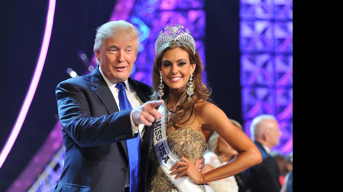 
In this June 16, 2013 file photo, Donald Trump, left, and Miss Connecticut USA Erin Brady pose onstage after Brady won the 2013 Miss USA pageant in Las Vegas, Nev. Univision says it is dropping the Miss USA Pageant and says it will cut all business ties with Donald Trump over comments he made about Mexican immigrants. The network said Thursday, June 25, 2015, it will not air the pageant on July 12, as previously scheduled, and has ended its business relationship with the Miss Universe Organization due to what it called "insulting remarks about Mexican immigrants" by Trump, a part owner. 
