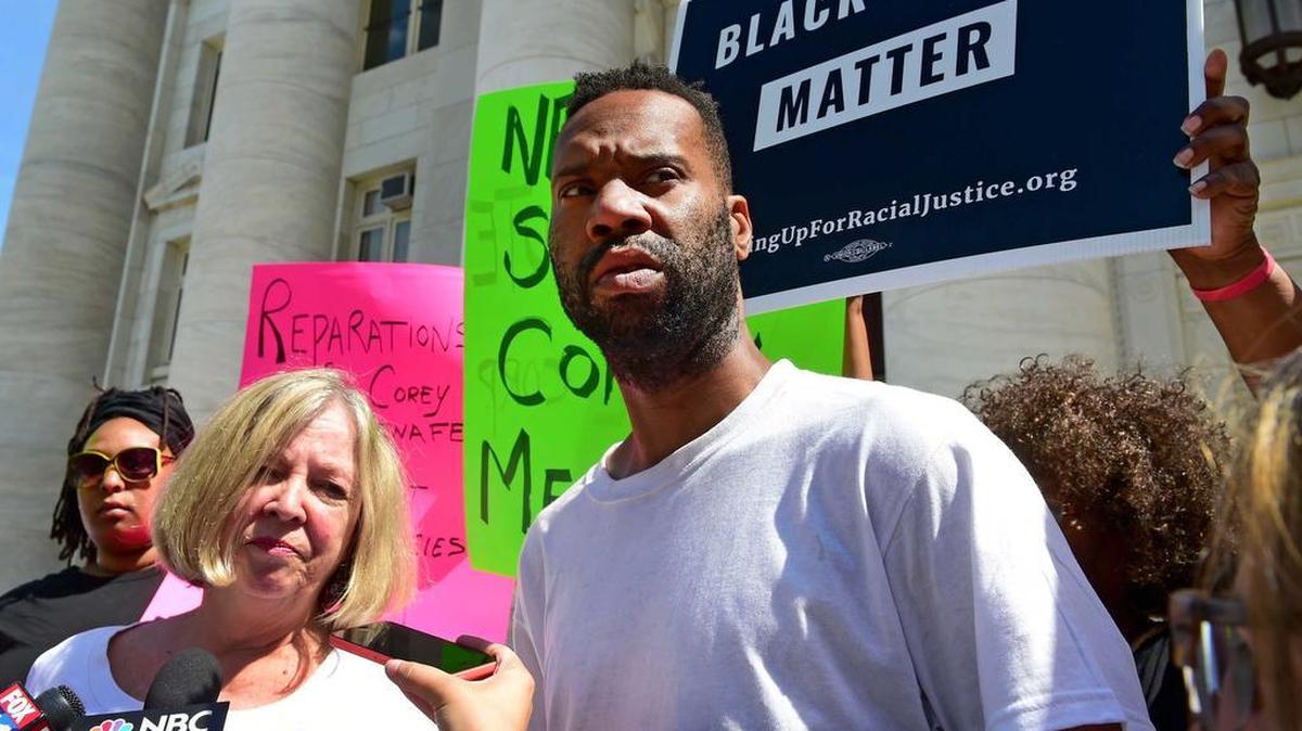 Corey Menafee, a dishwasher at Yale’s Calhoun College, talks to the press after destroying a stained-glass window pane depicting black slaves picking cotton. He faces a second-degree misdemeanor charge of reckless endangerment and a first-degree felony charge of criminal mischief, according to the New Haven Independent. He apologized to the college and resigned from his job.