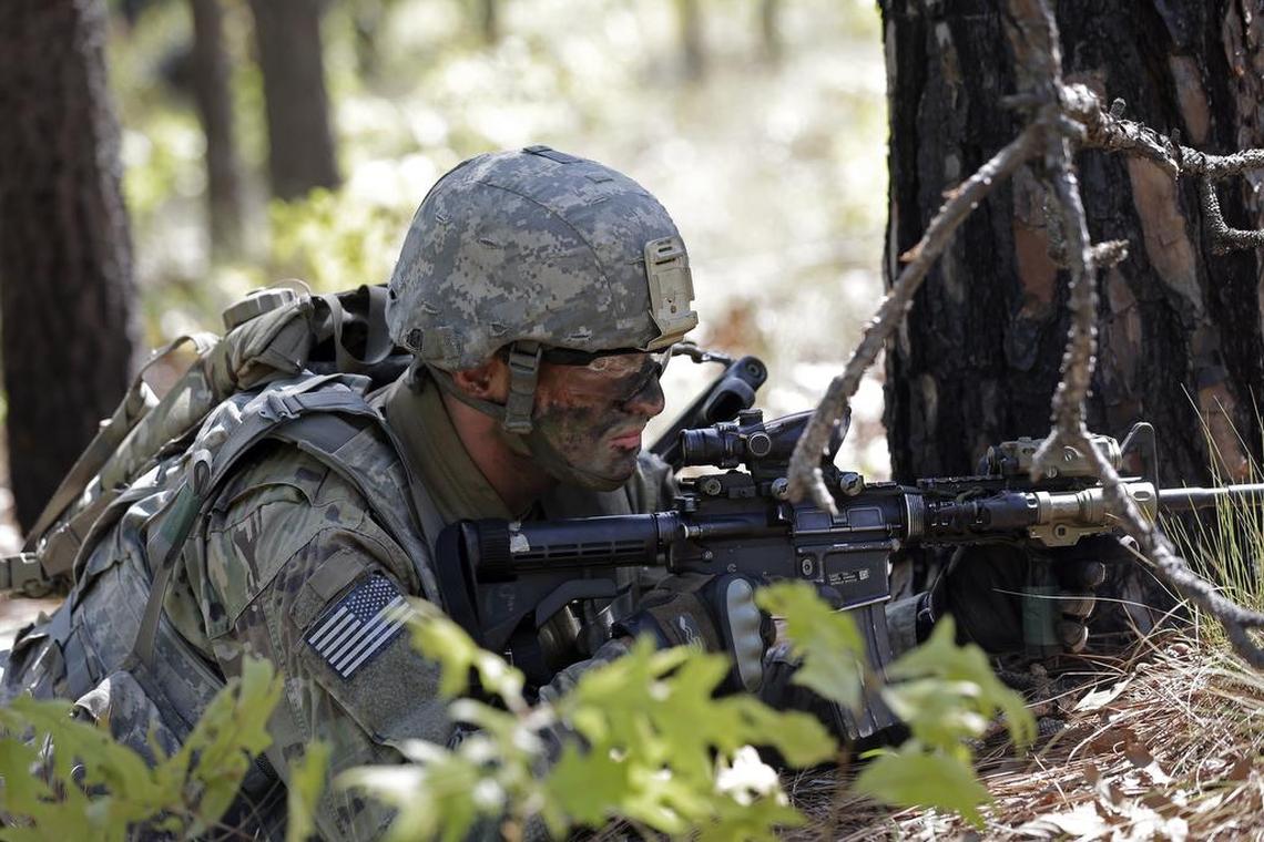 In this photo taken Friday, April 21, 2017, a paratrooper with the 82nd Airborne Division’s 3rd Brigade Combat Team participates in a training exercise at Fort Bragg, N.C. Struggling to expand its ranks, the Army will triple the amount of bonuses it’s paying this year to more than $380 million, including new incentives to woo reluctant soldiers to re-enlist, officials told The Associated Press.