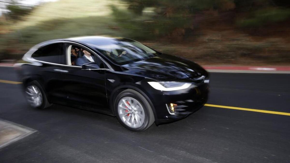 The Tesla Model X car is test driven at the company's headquarters on Sept. 29, 2015, in Fremont, Calif.