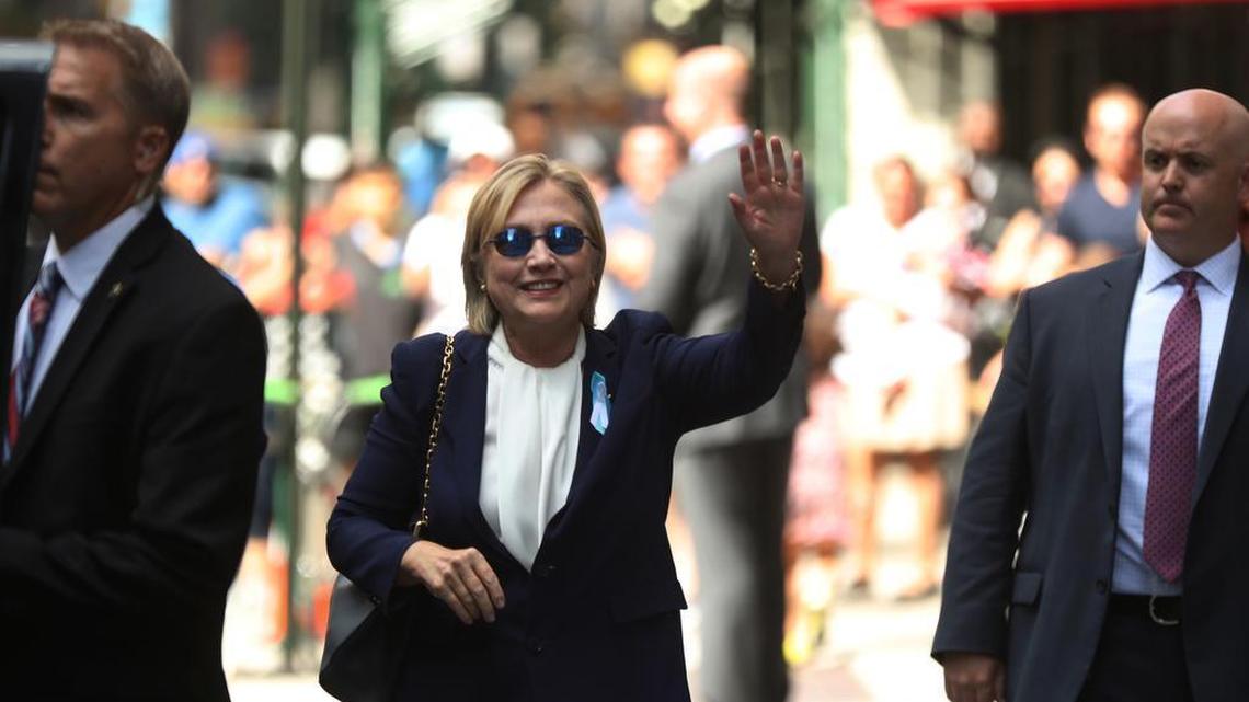 Democratic presidential candidate Hillary Clinton waves after leaving her daughter’s apartment building Sunday in New York. Clinton's campaign said the Democratic presidential nominee left a 9/11 anniversary ceremony in New York early after feeling "overheated."