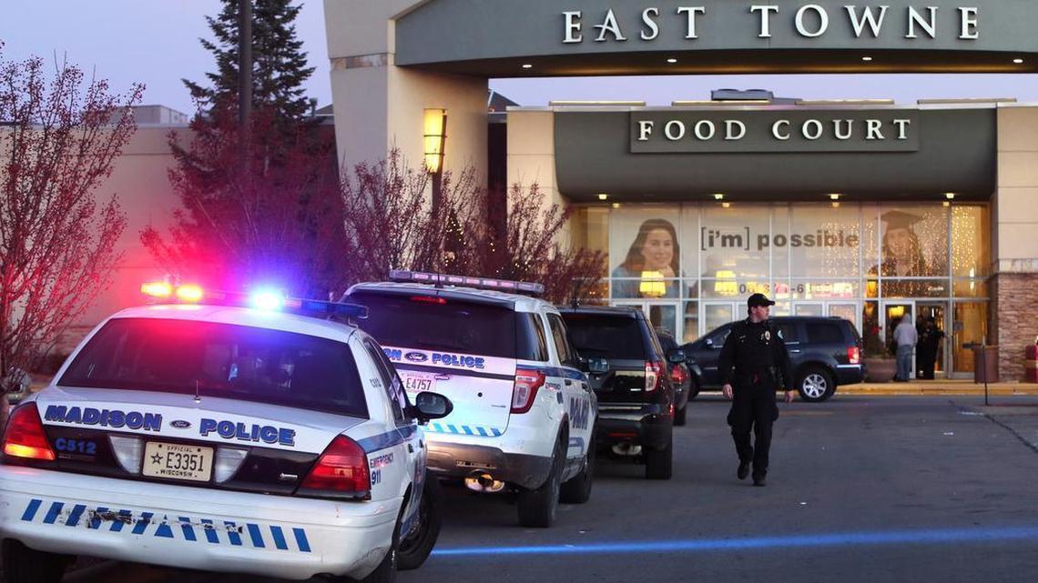 Authorities respond to reports of shots fired at East Towne Mall in Madison, Wis., Saturday, Dec. 19, 2015. Madison police said one person was shot in the leg during a “disturbance” inside the mall but his injuries are not life-threatening.