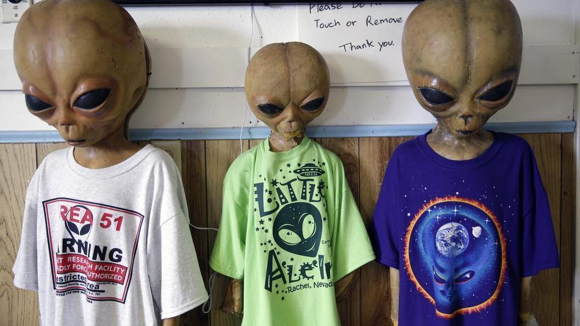 Alien dummies model t-shirts for sale along with other extraterrestrial-themed souvenirs at the Little A'Le'Inn, located nine miles up the road from the military testing base known as Area 51, in Rachel, Nev., Aug. 20, 2013.