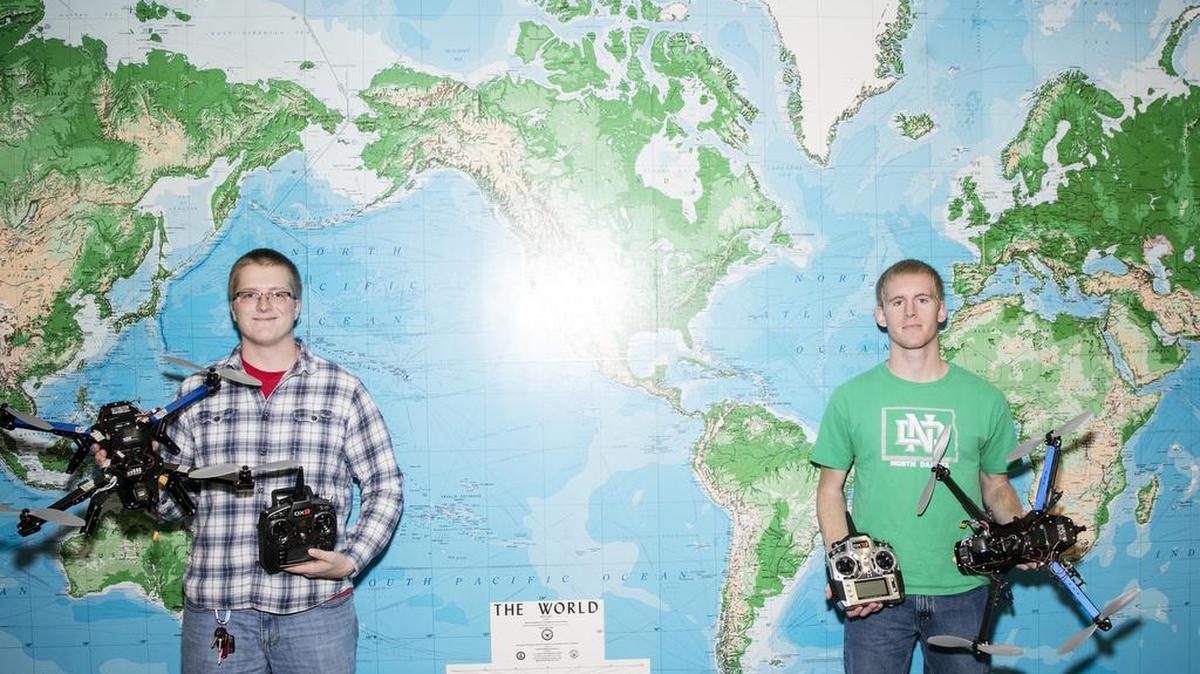 Ethan Voigt, left, and Jake Beaver with their quadcopters at the University of North Dakota in Grand Forks, N.D., Nov. 24, 2015. Encouraged by the state of North Dakota, a burgeoning industry in unmanned aircraft draws on local technical expertise and pilots.