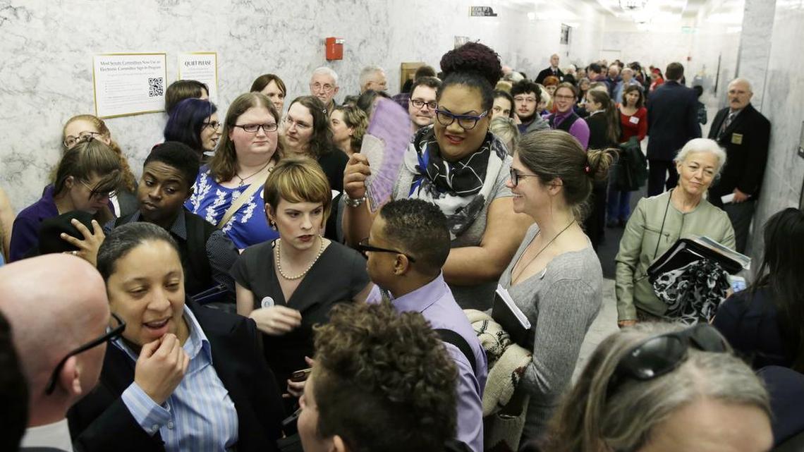 People pack a hallway outside a Washington Senate hearing room Wednesday, Jan. 27, 2016, at the Capitol in Olympia, Wash., as they wait to listen to public testimony regarding a bill that would eliminate Washington’s new rule allowing transgender people to use gender-segregated bathrooms and locker rooms in public buildings consistent with their gender identity.