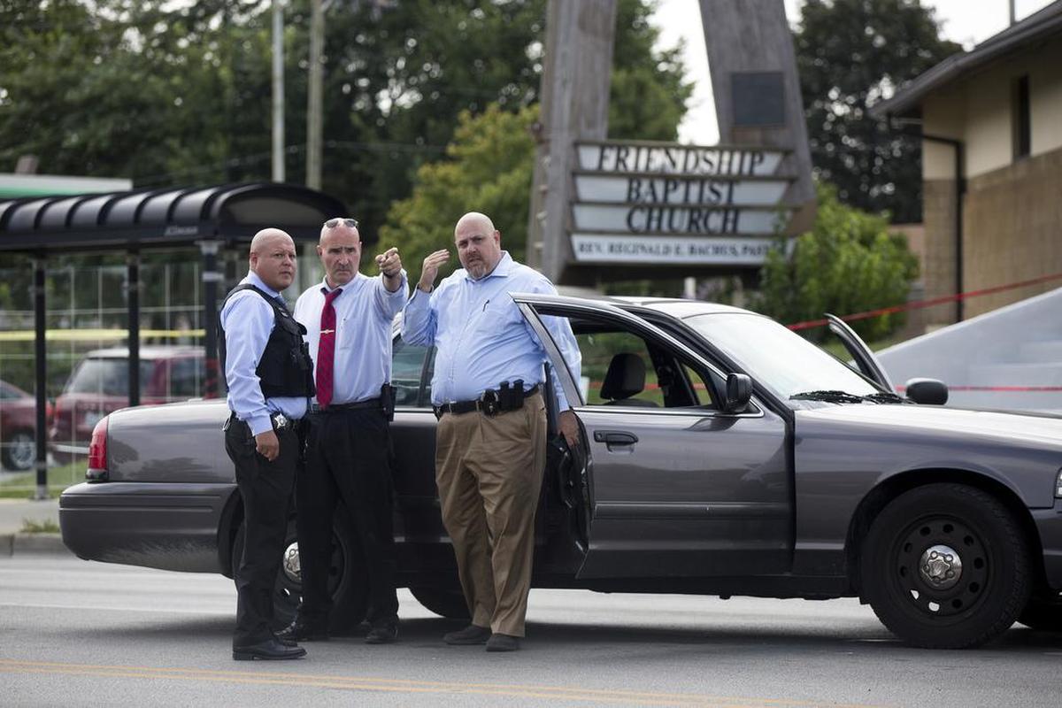 Chicago police officers investigate the scene of a double homicide on the steps of Friendship Baptist Church, located in the 200 block of South Laramie, on Sunday, Aug. 13, 2017, in Chicago’s Austin community.