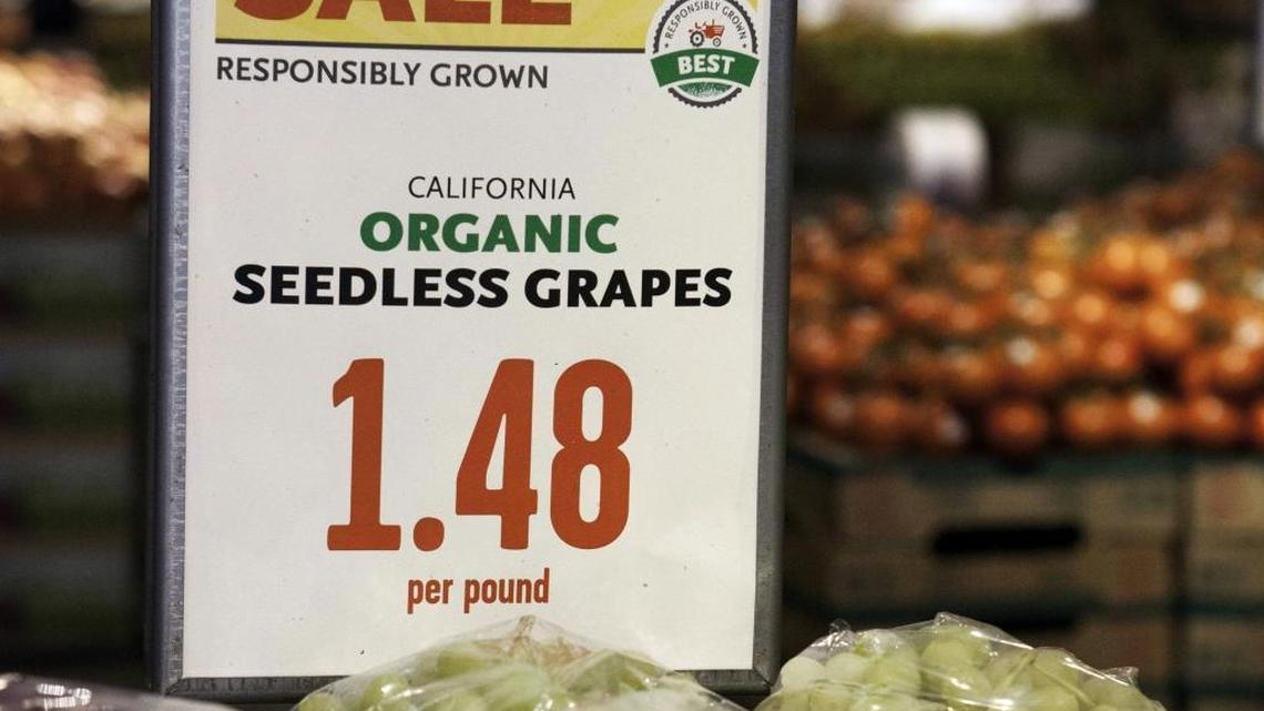 This September 2014 photo provided by Whole Foods shows an example of the company's "responsibly grown" labeling system on California organic seedless grapes.