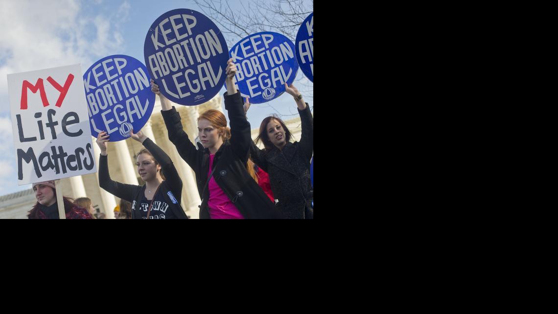 
Pro-abortion rights supporters hold up signs in front of the Supreme Court in Washington, Thursday, Jan. 22, 2015, as they wait for the arrival of anti-abortion demonstrators during the annual March for Life. Thousands of anti-abortion demonstrators gathered in Washington for an annual march to protest the Supreme Court’s landmark 1973 decision that declared a constitutional right to abortion. 
