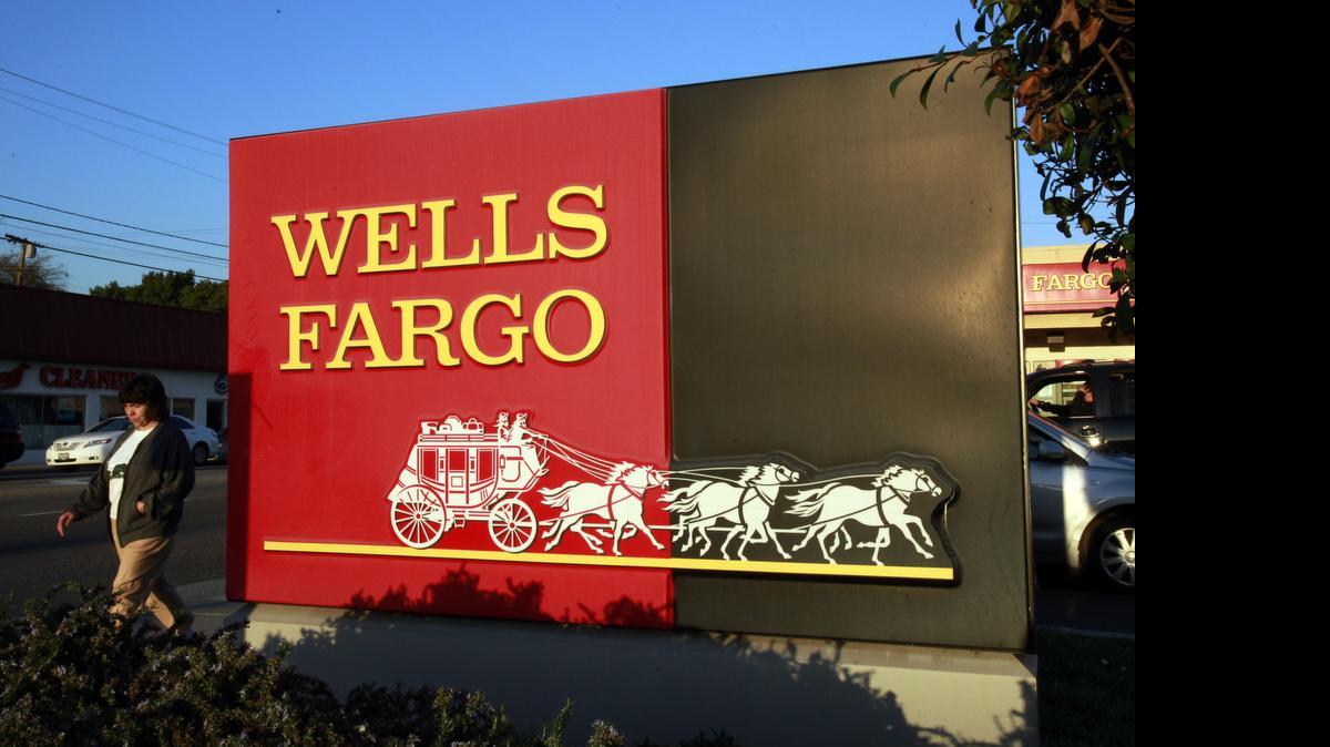 
A pedestrian walks by a Wells Fargo bank branch in Los Angeles on Jan. 18, 2011. The bank is being sued by the city of Los Angeles, which claims bank employees misused customers’ confidential information and often failed to close unauthorized accounts even when customers complained.
