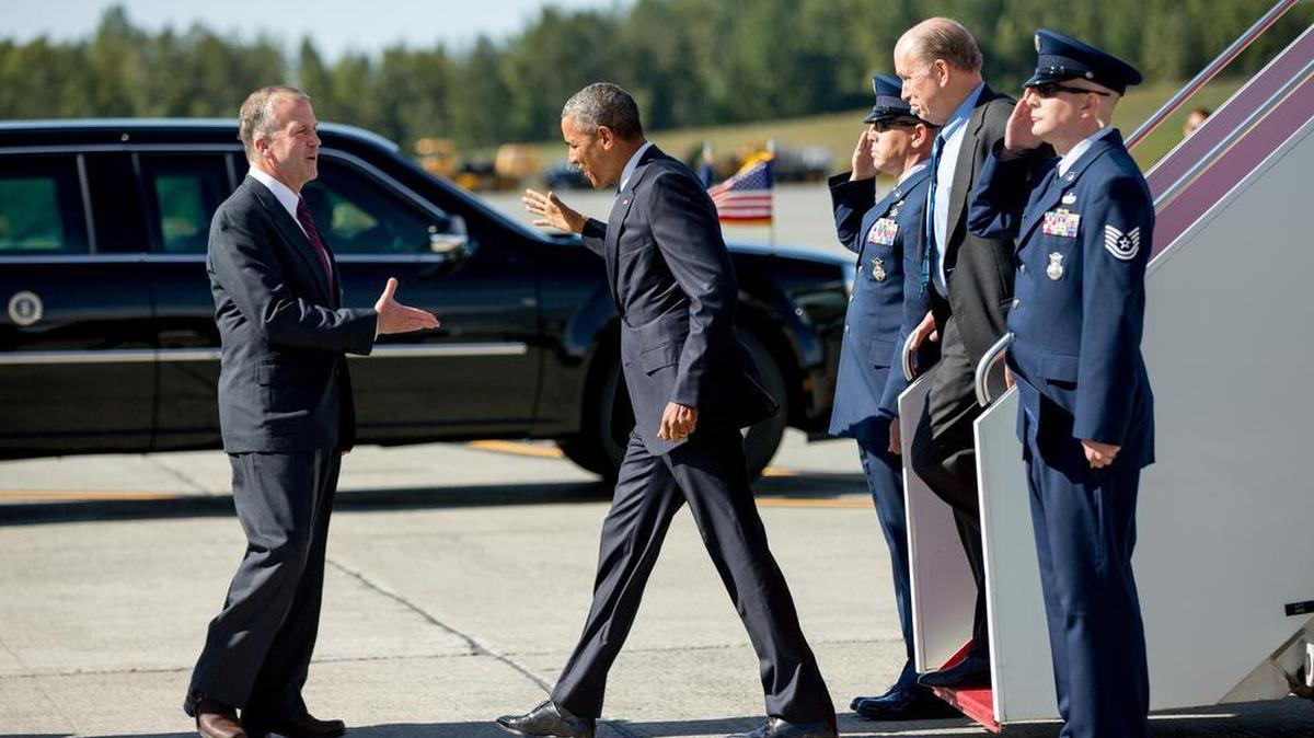 
President Barack Obama, accompanied by Alaska Gov. Bill Walker, second from right, greets Sen. Dan Sullivan, R-Alaska, left, as he steps off Air Force One after arriving at Elmendorf Air Force Base on Monday.
