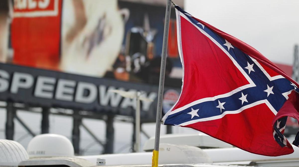 A handful of Confederate battle flags flew in the infield of Texas Motor Speedway before the NASCAR Xfinity Series O'Reilly Auto Parts Challenge.
