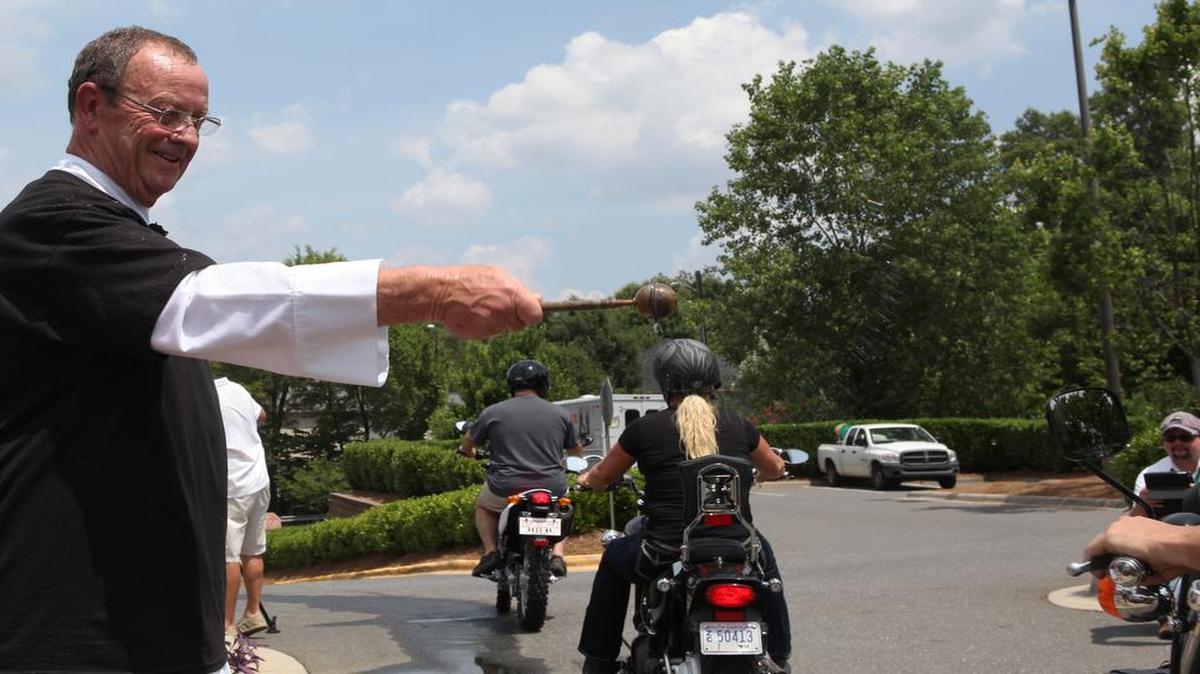 In 2014, Monsignor John McSweeney of St. Matthew Catholic Church blessed bikers with holy water at the first annual Blessing of the Bikes in 2014.