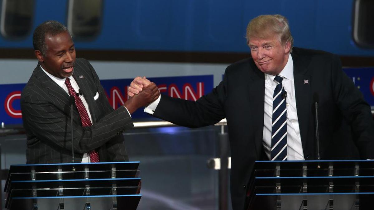 
GOP presidential candidates Ben Carson, left, and Donald Trump shake hands during the CNN Republican presidential debate at the Ronald Reagan Presidential Library on Wednesday in Simi Valley, Calif
