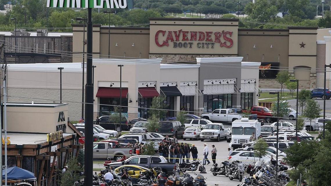 In this photo from May 17, 2015, authorities investigate a shooting in the parking lot of Twin Peaks restaurant in Waco, Texas. An indictment announced by the U.S. Attorney’s Office in San Antonio accuses three Bandidos leaders of sanctioning a three-year fight that included violent clashes with rival gangs and distribution of methamphetamine. The accusations focus on a rivalry that came under renewed attention in May, when a meeting of biker groups at a Twin Peaks restaurant in Waco, Texas, ended in gunfire that left nine people dead.