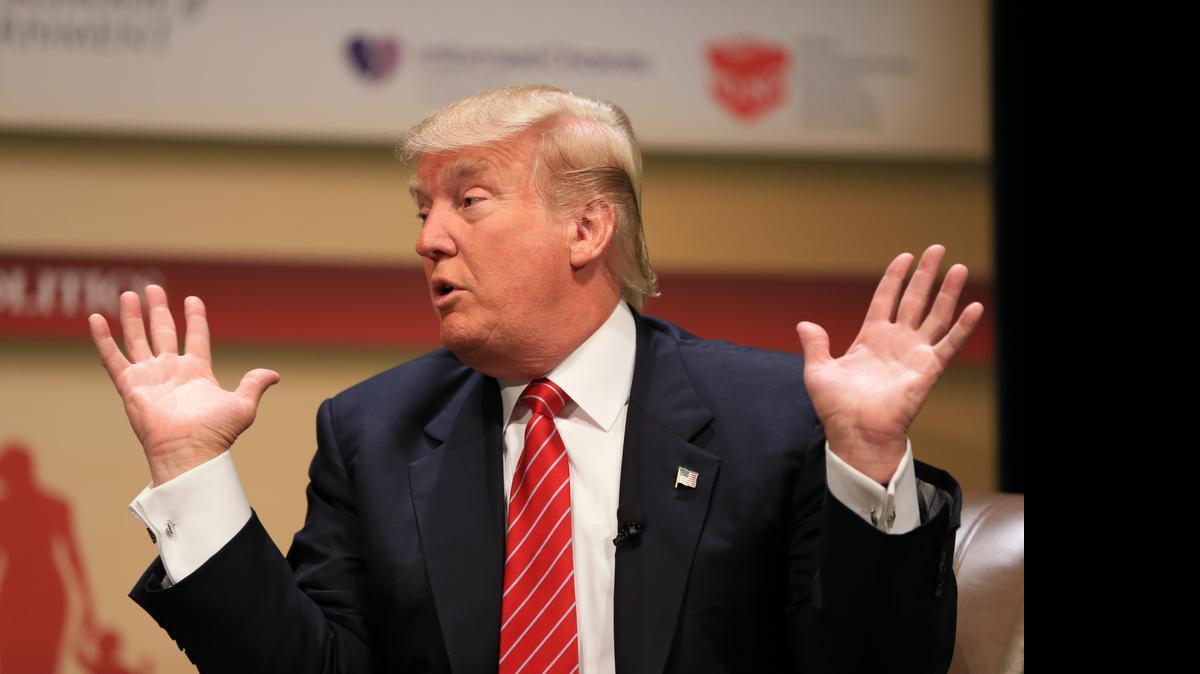 
Donald Trump speaks at Family Leadership Summit in Ames, Iowa, where he was dismissive of Sen. John McCain’s war service.

