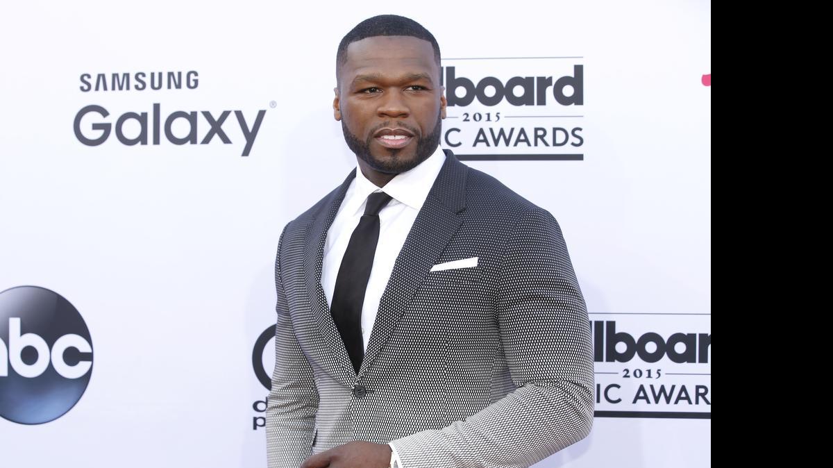 
In this May 17, 2015, photo, 50 Cent arrives at the Billboard Music Awards at the MGM Grand Garden Arena in Las Vegas. Someone else's sex tape is proving to be costly for 50 Cent: A jury ordered the rapper-actor Friday, July 10, 2015, to pay $5 million to a woman who said he acquired a video she made with her boyfriend, added himself as a crude commentator and posted it online without her permission. 
