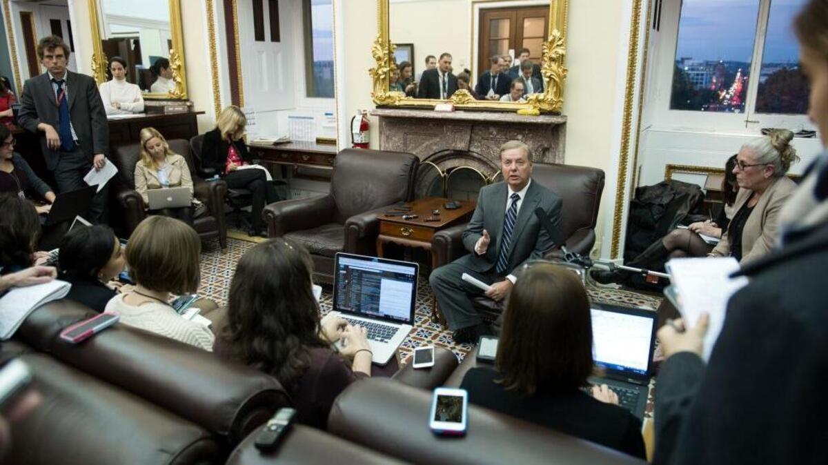 Sen. Lindsey Graham, R-S.C. with reporters in the Senate Press Gallery in Washington.