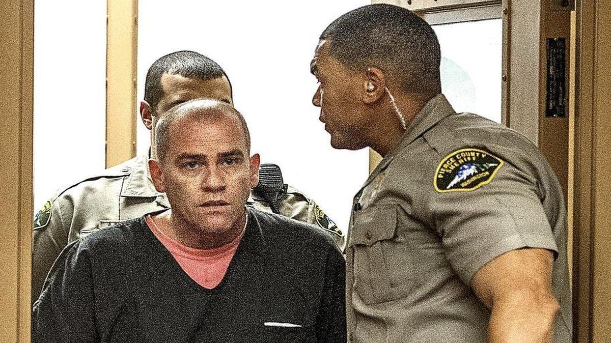 Tracy Worwood of Tacoma is led into court Thursday during his arraignment on charges of unlawful possession of an explosive device and reckless endangerment. Worwood was released on his own recognizance.