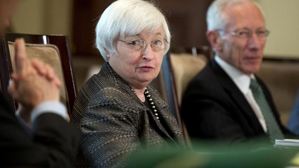 
In this July 20, 2015, photo, Federal Reserve Chair Janet Yellen, from left, with Vice Chairman Stanley Fischer, and the board of governors of the Federal Reserve System, presides over a meeting in Washington. Nine years after they last raised their benchmark interest rate and after months of feverish speculation, Federal Reserve policymakers this week may finally raise that rate from a record low near zero.

