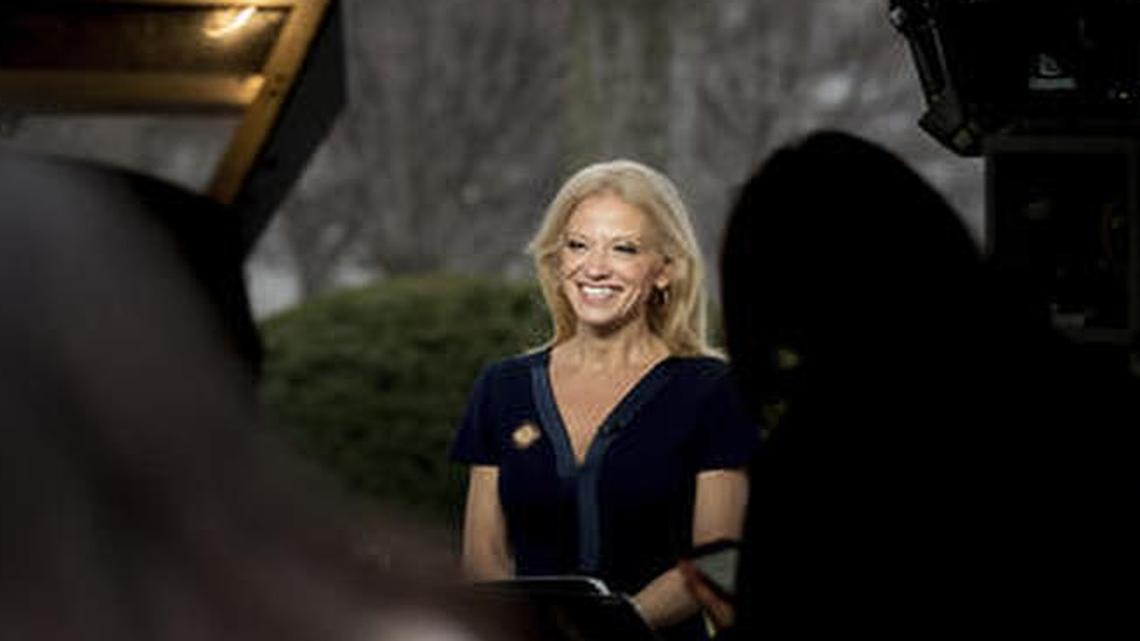 President Donald Trump's adviser Kellyanne Conway gets ready to speak on television outside the White House Sunday.