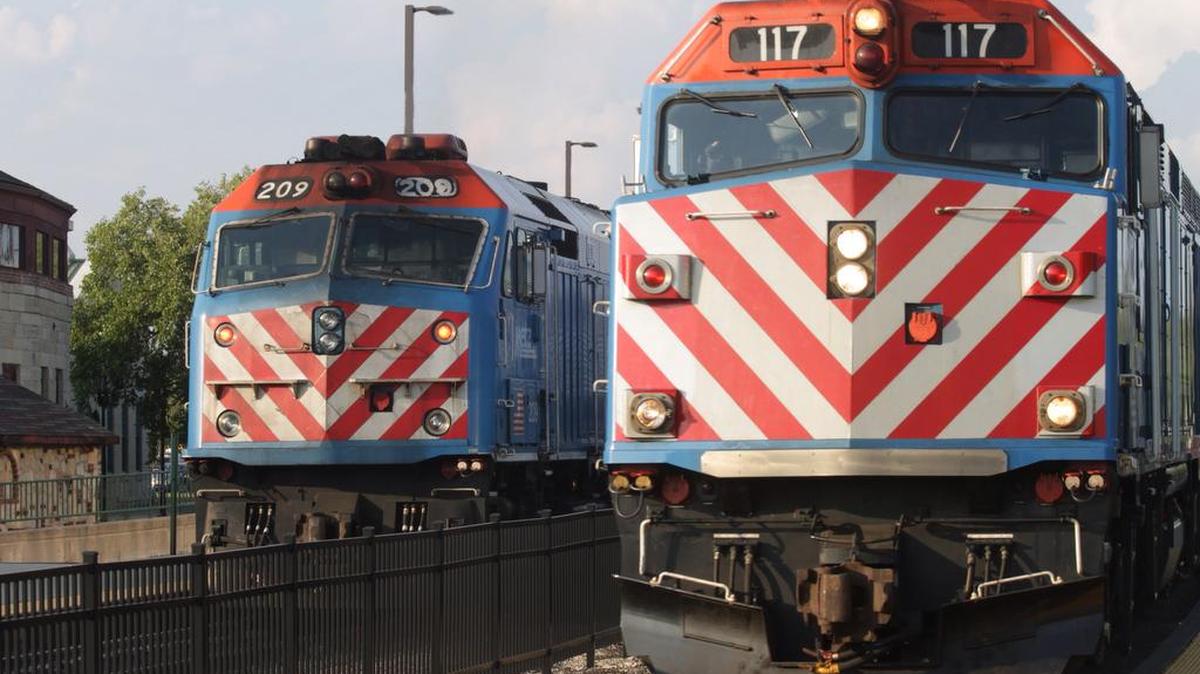 
Metra commuter trains pause at Aurora, Ill., on Aug. 19, 2014, before returning to Chicago. A monthlong shutdown of rail service could force more than 38 million commuters to drive to work or stay home.
