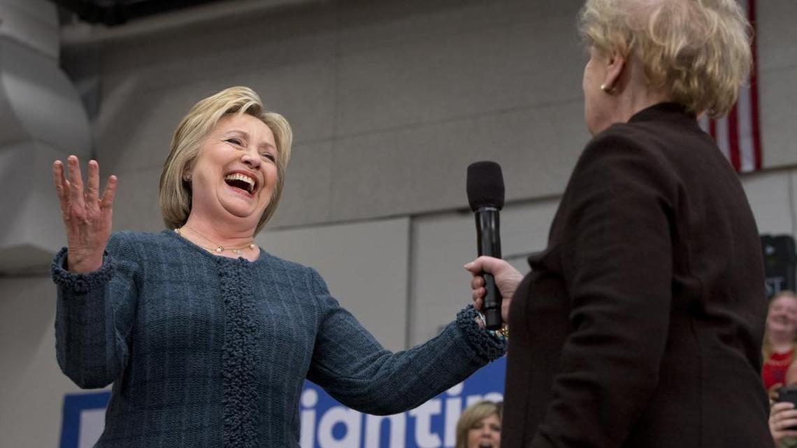 Democratic presidential candidate Hillary Clinton reacts after former Secretary of State Madeleine Albright said, "there’s a special place in hell for women who don’t help each other," while introducing Clinton at a campaign event at Rundlett Middle School, in Concord, N.H., Saturday Feb. 6, 2016.