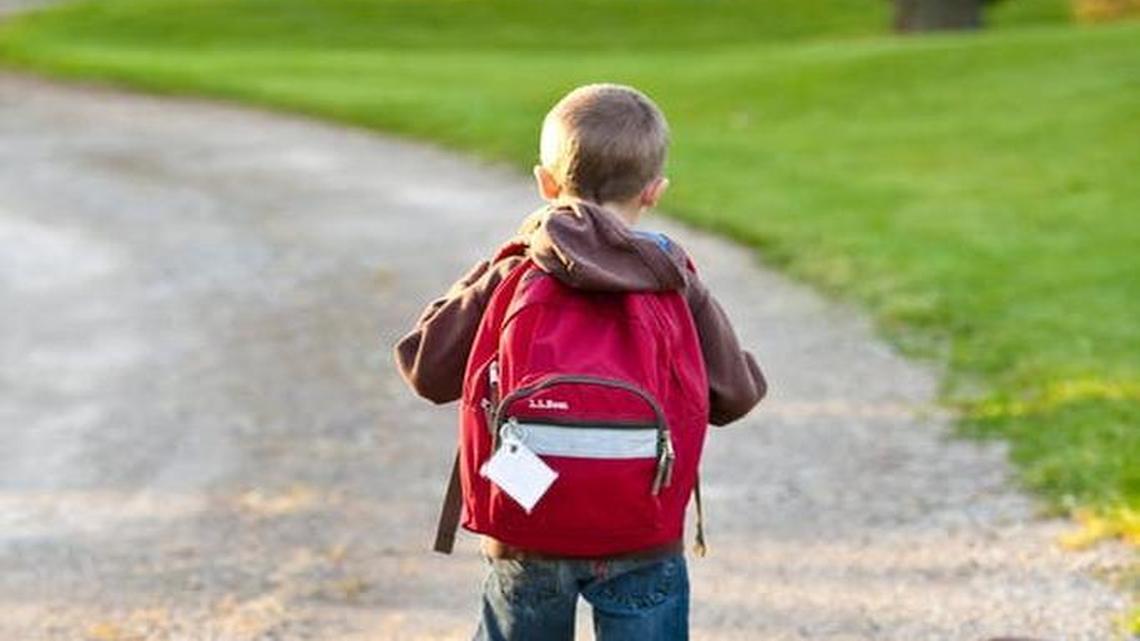 Like the young boy in this photo, 5-year-old Jackson Riley wore a backpack to school. Jackson did not want to take it off in class.