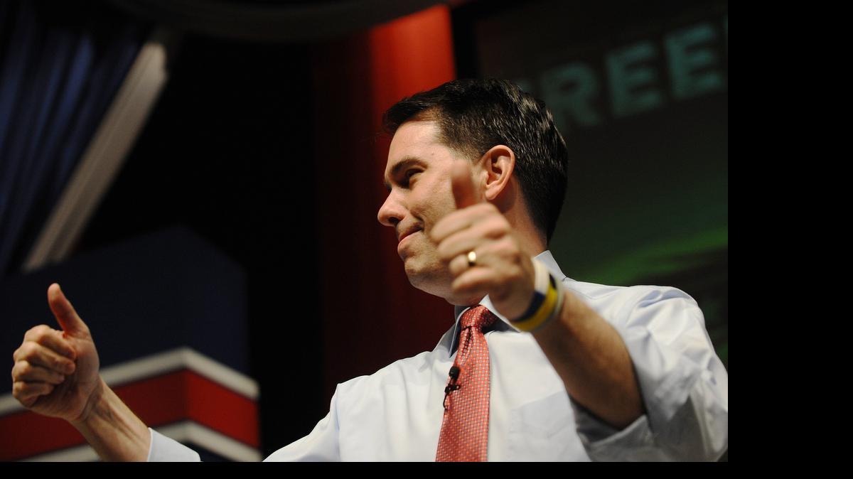 
Wisconsin Gov. Scott Walker gestures as he speaks at the Freedom Summit on May 9, 2015, in Greenville, S.C. Several hundred Republican activists are gathered to hear from almost a dozen declared and potential presidential candidates including Walker.
