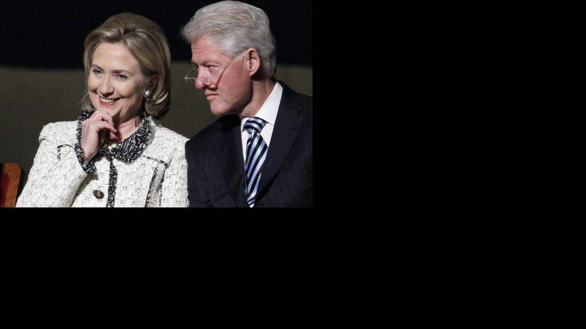 
 Then-Secretary of State Hillary Clinton and former President Bill Clinton are pictured at an event in Washington on Jan. 14, 2011. 
