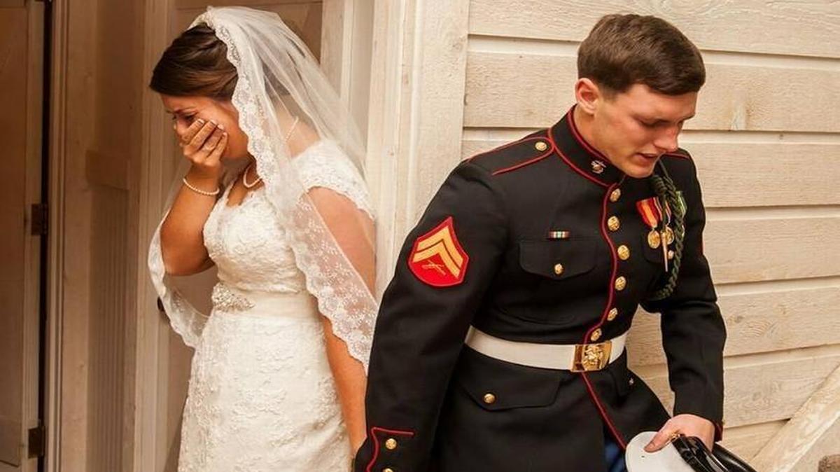 
Maggie and Marine Cpl. Caleb Earwood pray before their Memorial Day weekend near Asheville, NC. | 

