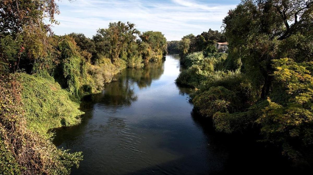 The Stanislaus River seen from the First Street Bridge in Riverbank, California.