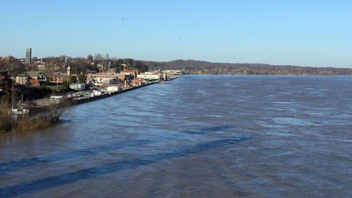 Swollen water of the Mississippi River rushes by Cape Girardeau, Mo., Saturday, Jan. 2, 2016. Missouri Gov. Jay Nixon stopped in Cape Girardeau, where about two dozen homes were damaged.