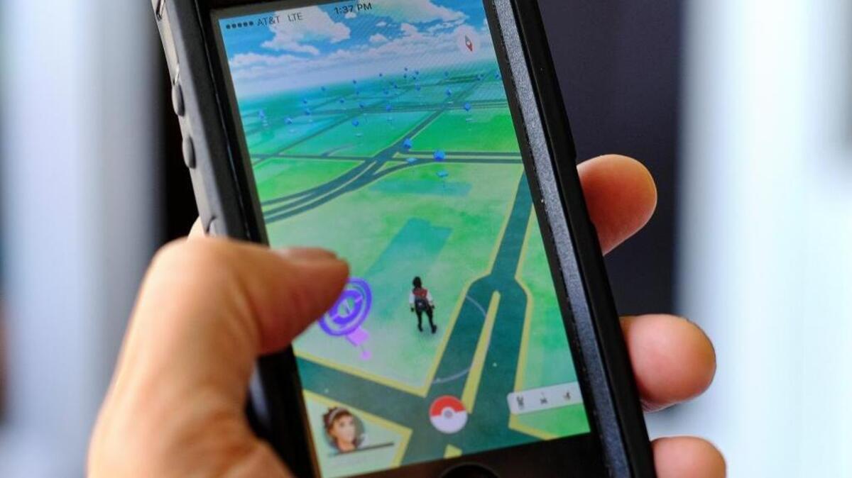 The game "Pokemon GO" displayed on a phone.