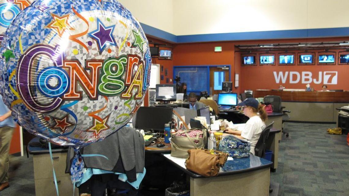 
Balloons hang from the desk of WDBJ's Melissa Ott, who was engaged to cameraman Adam Ward at the station in Roanoke, Va., Wednesday. Ward and reporter Alison Parker were fatally shot on air by Vester Lee Flanagan, a former staffer who used the on-air name of Bryce Williams and was fired by WDBJ. Ward's fiancée, station producer Ott, was in the control room marking her last day on the job when the shots rang out. Ward had planned to follow her to her new job in Charlotte, N.C. 
