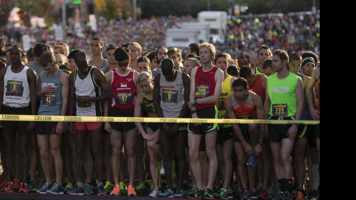 
Runners wait for the race to begin during the 32nd annual California International Marathon on Sunday, Dec. 7, 2014. Organizers of sports events in California’s capital are concerned that the nation’s largest railroad may not allow participants to cross tracks, forcing them to reroute or cancel more races.
