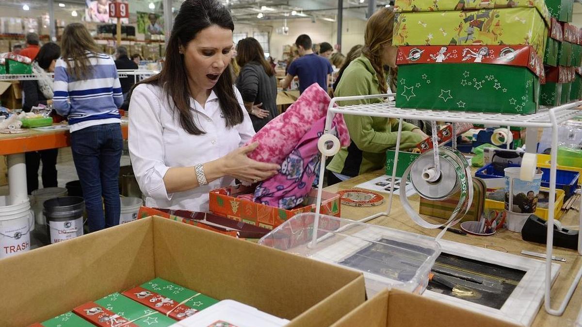 Once a shoe box recipient, Izabella McMillon, originally from Romania and now living in the United States, is excited after she sees what’s inside one of the Operation Christmas Children shoe boxes. Sponsored by Samaritan's Purse, Operation Christmas Child is a project of the Boone-based Christian charity that collects shoeboxes filled with gifts and gets them to children around the world.