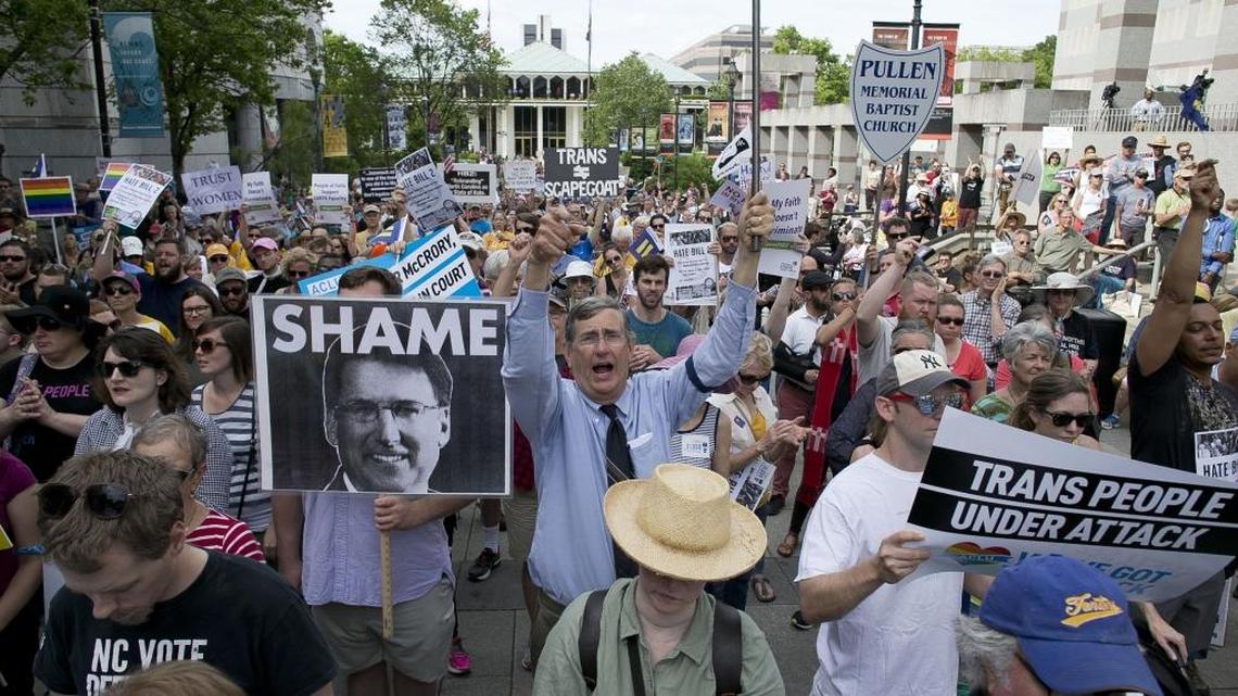 John Chase of Durham, center, follows the chants of North Carolina NAACP President Rev. William Barber during a rally in opposition of House Bill 2 in Raleigh on April 25.