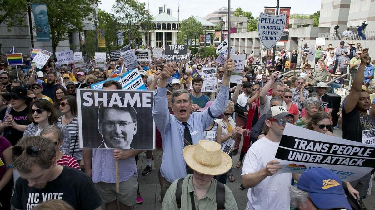 John Chase of Durham, center, follows the chants of North Carolina NAACP President Rev. William Barber during a rally in opposition of House Bill 2 in Raleigh on April 25.