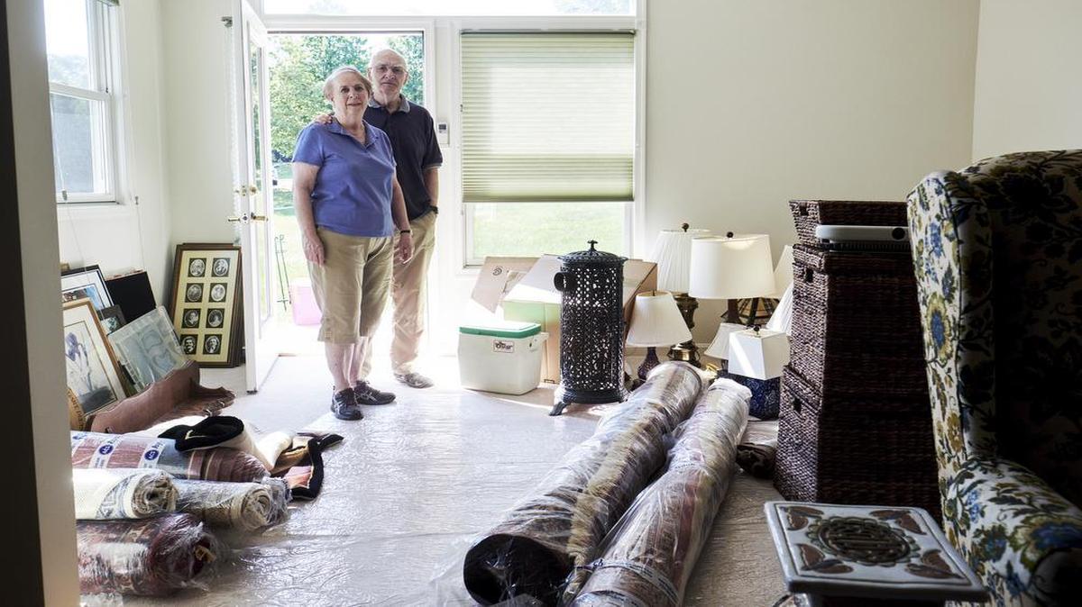 Tena and Ray Bluhm in their new home in the Westminster retirement community in Lake Ridge, Va., Aug. 10, 2017. The Bluhms moved in to their new home in early August, and needed to sort through items to determine what they needed and could fit in the smaller space. How to dispose of a lifetime of memories and keepsakes? These days, it pays to ask a professional, not your heirs.