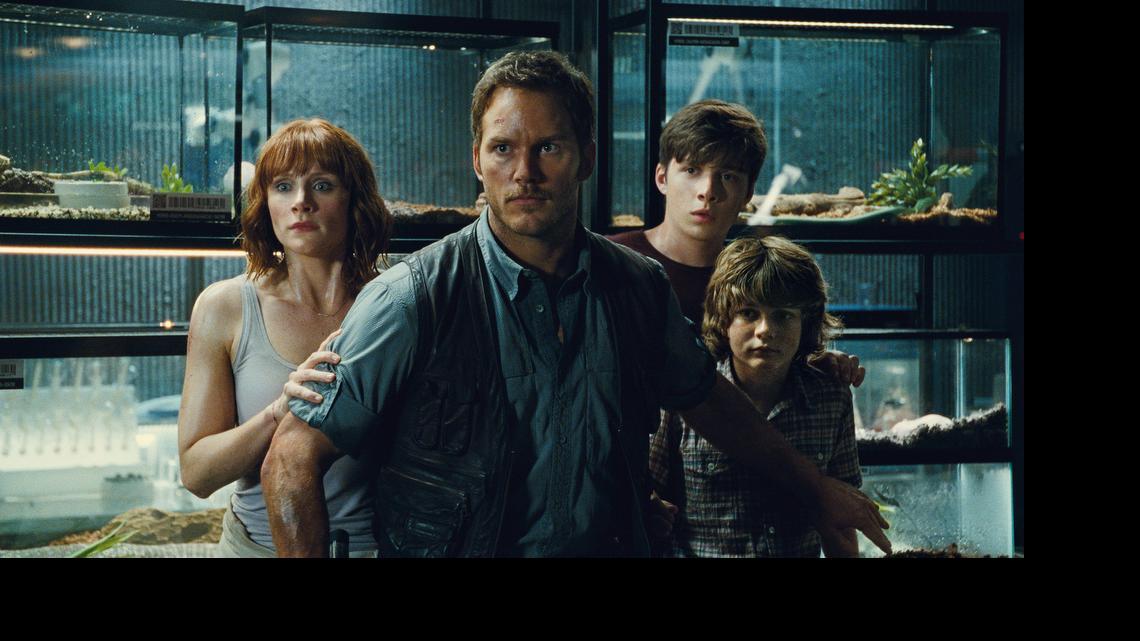 
This photo provided by Universal Pictures shows, Bryce Dallas Howard, from left, as Claire, Chris Pratt as Owen, Nick Robinson as Zach, and Ty Simpkins as Gray, in a scene from the film, "Jurassic World," directed by Colin Trevorrow, in the next installment of Steven Spielberg's groundbreaking "Jurassic Park" series. The Universal Pictures 3D movie releases in theaters on June 12, 2015. 
