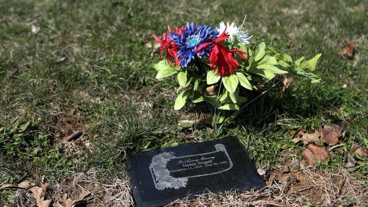 Grave marker of Helen Stigall, whose body was discovered in an abandoned bus in 1989 but was not buried for 26 years, at Evergreen Memorial Gardens in Paris.