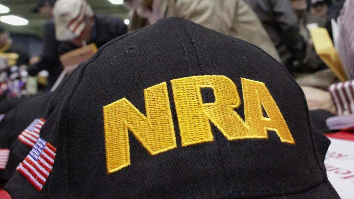 Illinois gun owners and supporters file out National Rifle Association applications while participating in an Illinois Gun Owners Lobby Day convention before marching to the Illinois state Capitol in Springfield, Ill.