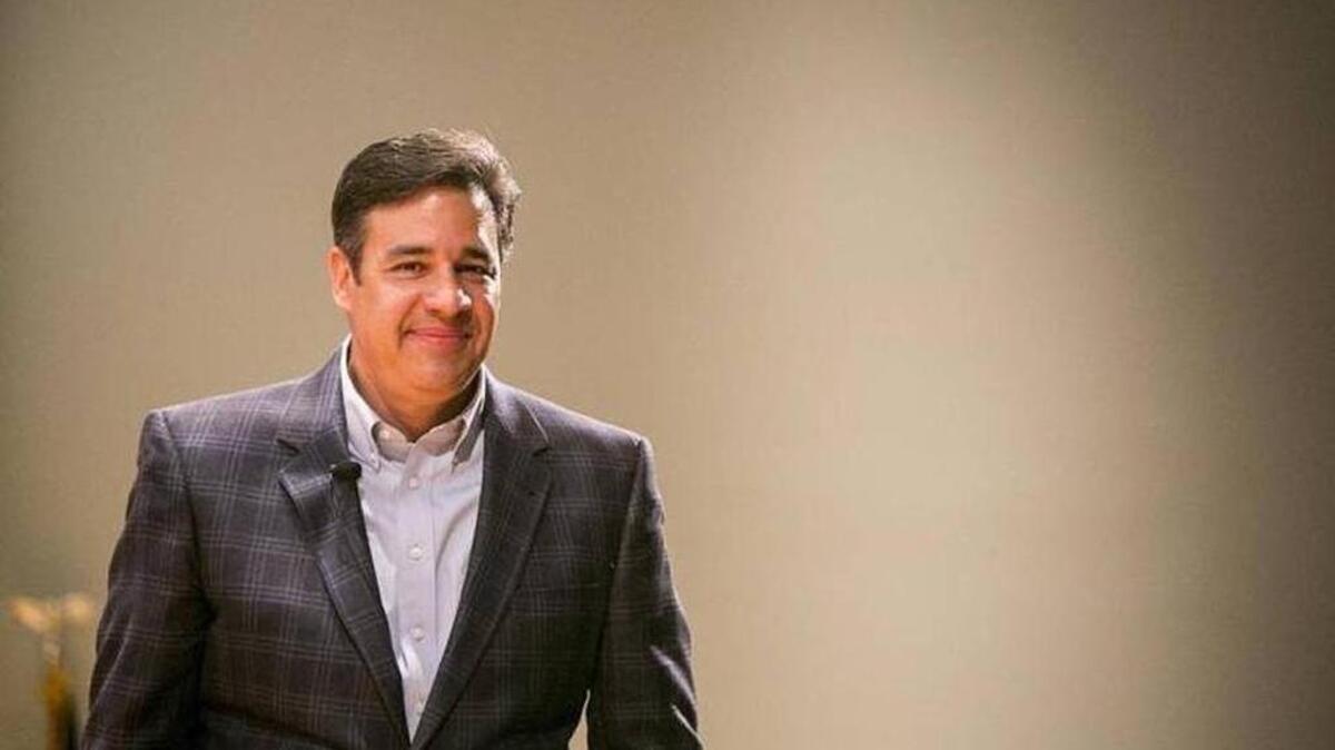Rep. Raúl Labrador smiles during a moment at his town hall meeting in Meridian in April. Facing a mostly opposition audience, he at one point remarked: “I’m super popular tonight.