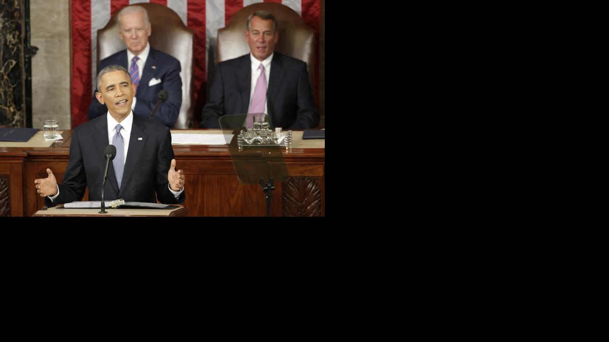 
President Barack Obama gives his State of the Union address before a joint session of Congress on Capitol Hill in Washington, Tuesday, Jan. 20, 2015, Vice Presient Joe Biden and House Speaker John Boehner of Ohio listen. 
