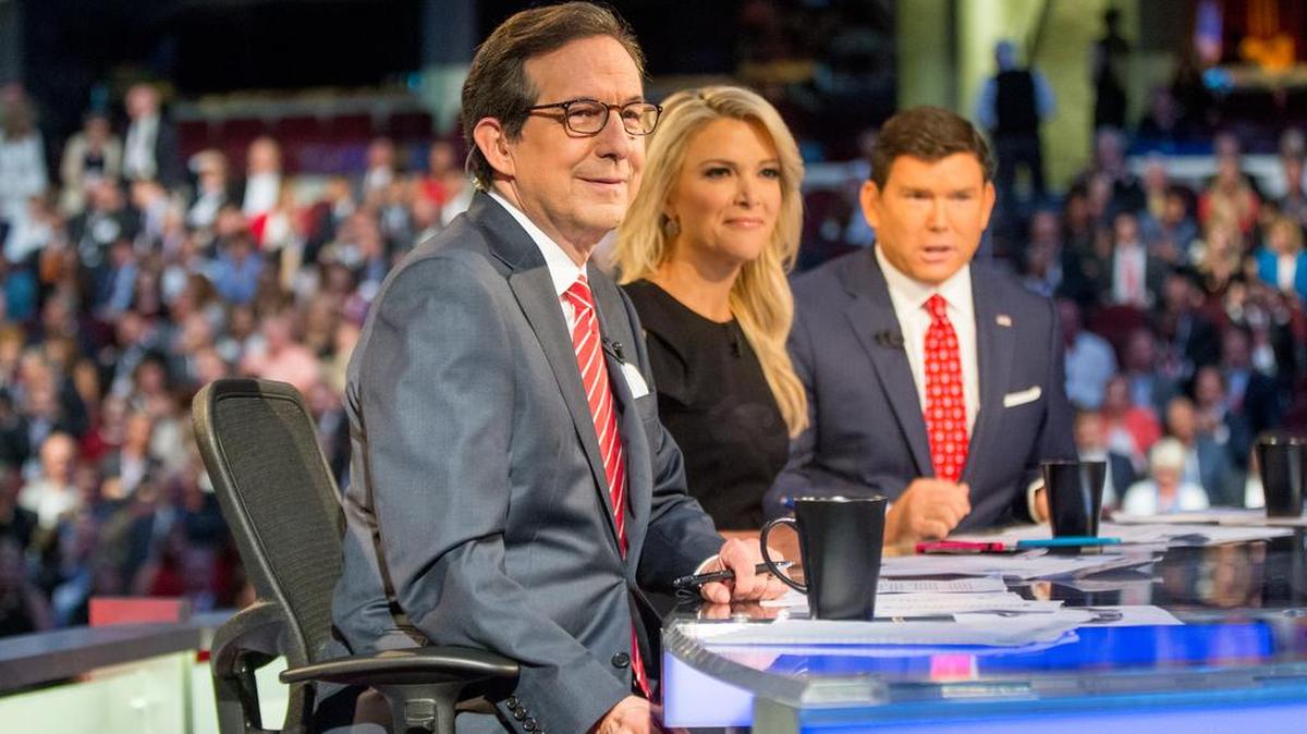 
Fox News moderators from left, Chris Wallace, Megyn Kelly and Bret Baier speak to the camera before Republican presidential candidates  take the stage for the first Republican presidential debate at the Quicken Loans Arena, Thursday, Aug. 6, 2015, in Cleveland. 
