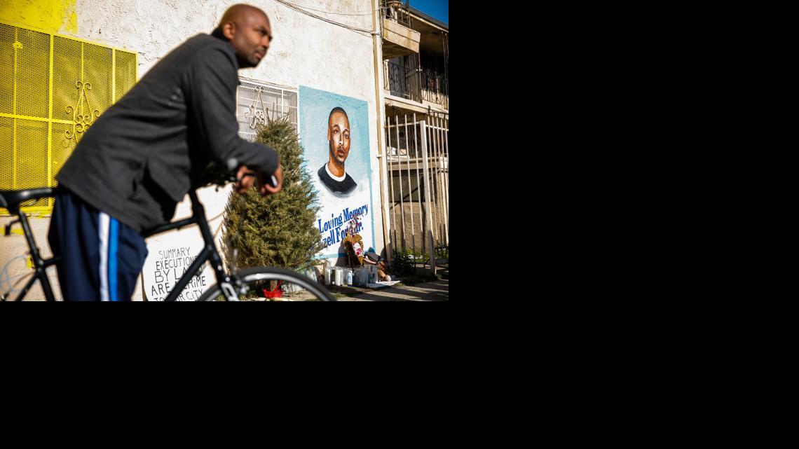 
Edsell Ford, father of Ezell Ford, an unarmed black man memorialized on the wall behind, listens to a press conference with Los Angeles civil rights leaders at the corner of 65th Street and Broadway on Dec. 27, 2014 in south Los Angeles, the site of the LAPD's August fatal shooting of Ford. 
