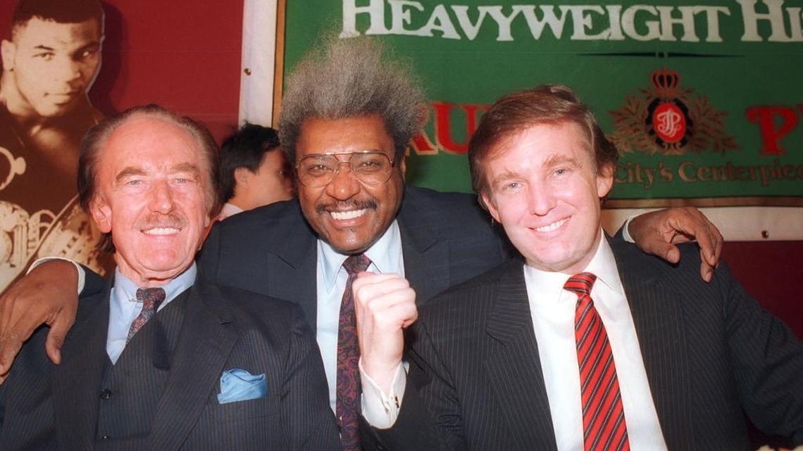 Donald Trump, right, with his father, Fred Trump, far left, and boxing promoter Don King attend a press conference in December 1987 in Atlantic City, N.J.