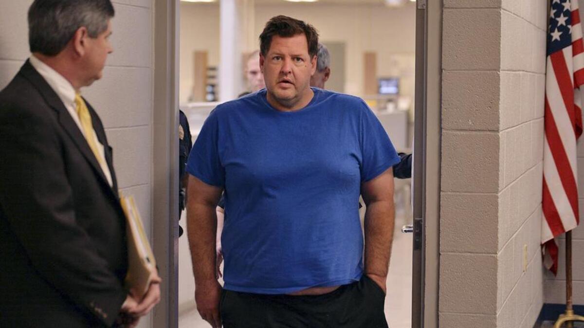 Todd Kohlhepp is escorted into a Spartanburg County magistrate courtroom, Friday, Nov. 4, 2016, in Spartanburg, S.C.. Kohlhepp, a 45-year-old registered sex offender with a previous kidnapping conviction, appeared at a bond hearing Friday on a kidnapping charge in connection to a woman being found chained inside a storage container on a property in Woodruff, S.C. More charges will be filed later, the prosecutor told the court.